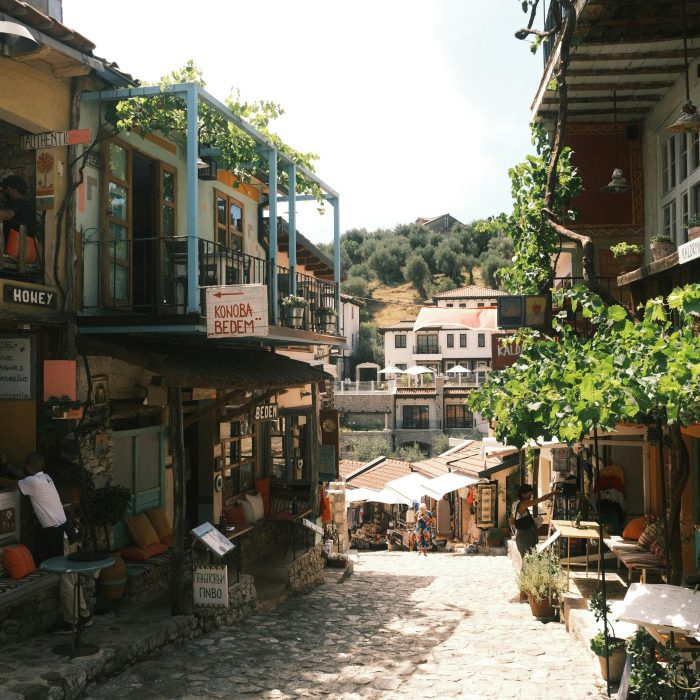 Explore the cozy streets of Bar, Montenegro, lined with quaint shops and lush greenery.